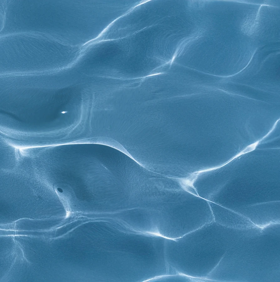 An abstract background of deep blue water with bright white light refractions (caustics) shimmering across the surface.